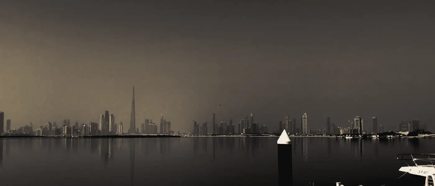 The Dubai skyline across Dubai Creek on a hazy morning